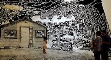 Oscar Oiwa a desenat o insula pe peretii unei scoli