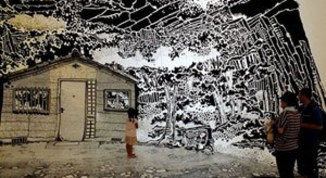 Oscar Oiwa a desenat o insula pe peretii unei scoli